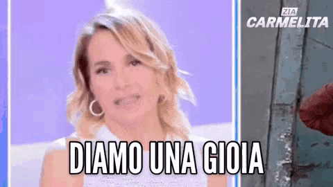 a close up of a woman 's face with the words diamo una gioia written on it .