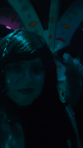 a poster for a movie called shagarita shows a woman in a dark room