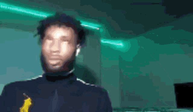 a blurry picture of a man with headphones and a banana in his hand