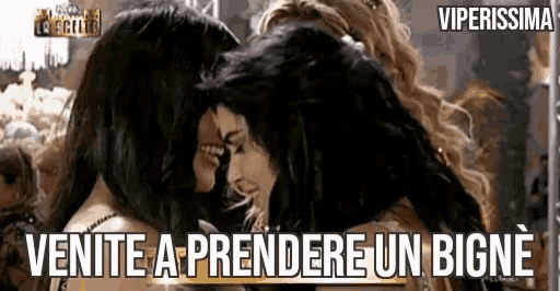 a group of women hugging each other with the words venite a prendere un bigne in the corner .