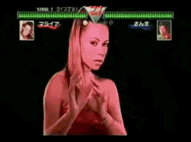 a man and a woman are fighting in a video game . the woman is wearing a red dress .