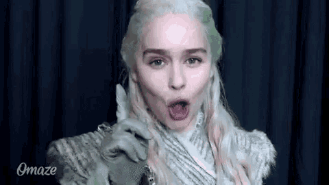 a woman in a wig is making a funny face .