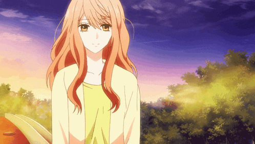 a girl with long orange hair stands in front of trees