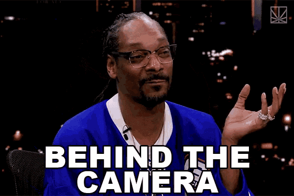 snoop dogg says behind the camera while wearing glasses