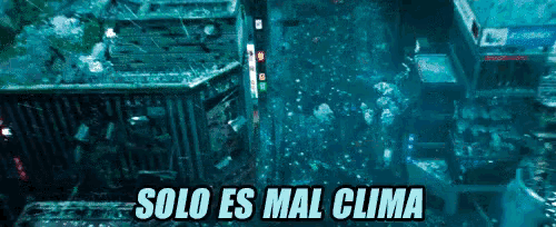 an aerial view of a city with the words solo es mal clima in white letters