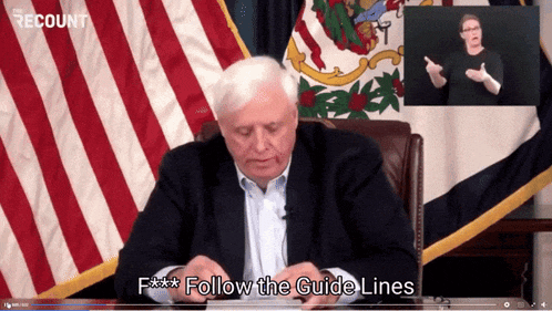 a video of a man sitting at a desk with the words follow the guide lines