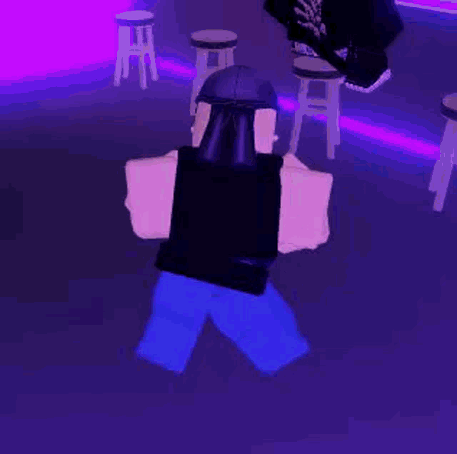 a couple of roblox characters are standing next to each other in a room .
