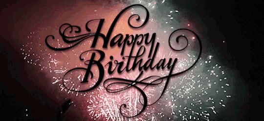 a fireworks display behind the words happy birthday