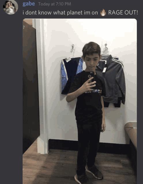 a boy taking a picture of himself in a dressing room with a caption that says gabe today at 7:10 pm