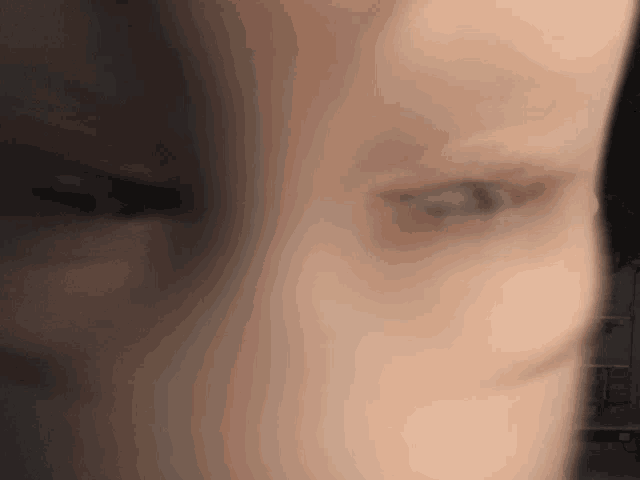 a blurry picture of a person 's face with a few lines visible