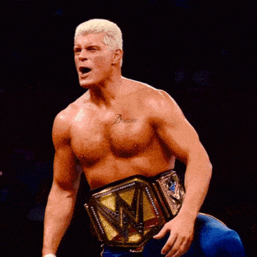 a shirtless wrestler with a tattoo on his chest that says dream