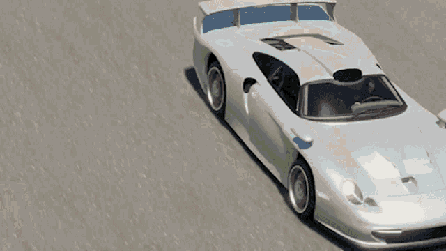a red car and a white car are driving down a race track