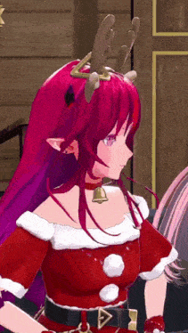a girl with red hair is wearing a reindeer antlers headband