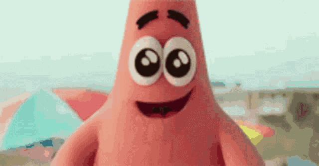patrick star from spongebob squarepants is smiling with big eyes .
