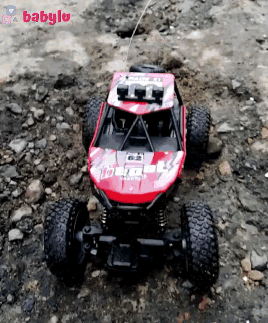 a red and black toy car with the word racing on it