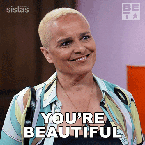a picture of a woman with the words you 're beautiful on the bottom