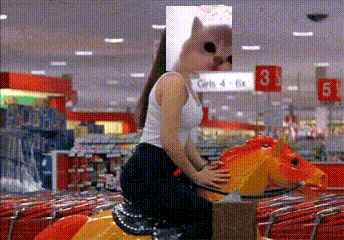 a woman is riding a toy horse in a store with a cat on her face