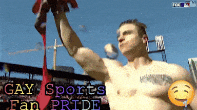 a shirtless man is holding up a red flag with the words gay sports fan pride written below him