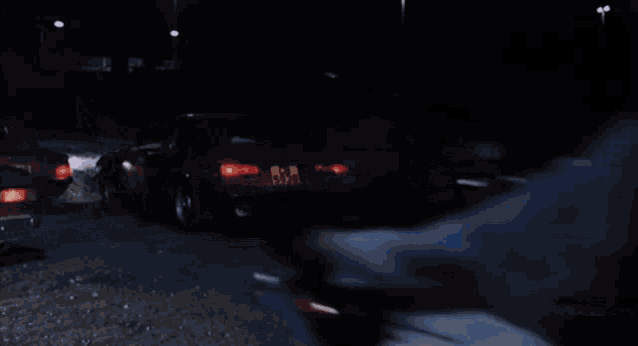 a man wearing a helmet is riding a motorcycle with a license plate that starts with a t