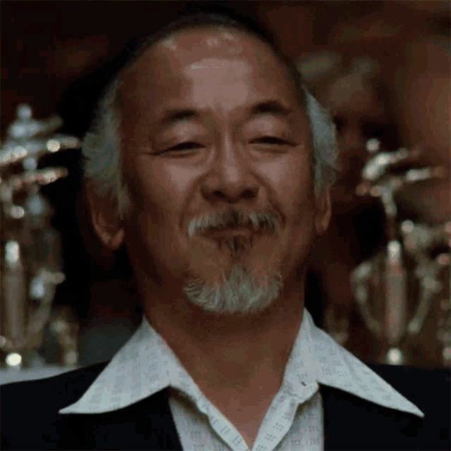 a man with a beard wearing a shirt that says ' ii ' on it