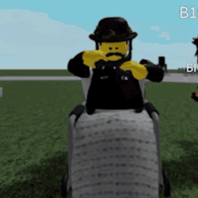 a lego man wearing a top hat and mustache is riding a wheelchair
