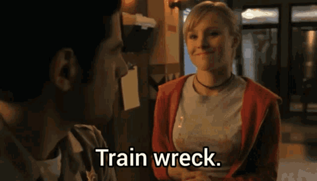 a man and a woman are talking and the woman says " train wreck "