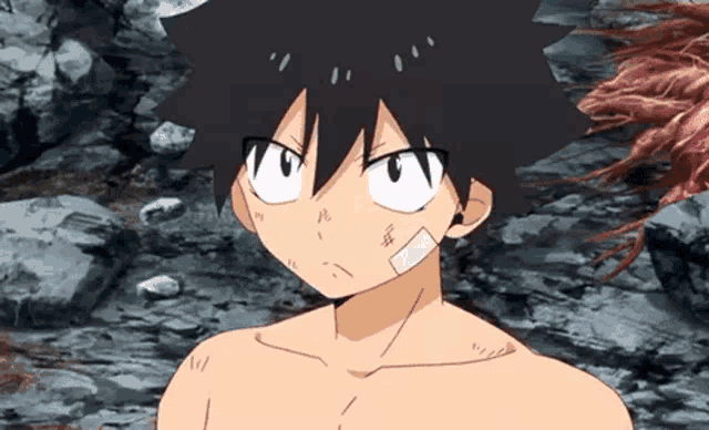 a shirtless anime character with a bandage on his face is standing in a rocky area .