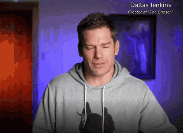 a man wearing a grey hoodie with dallas jenkins creator of the chosen on the bottom