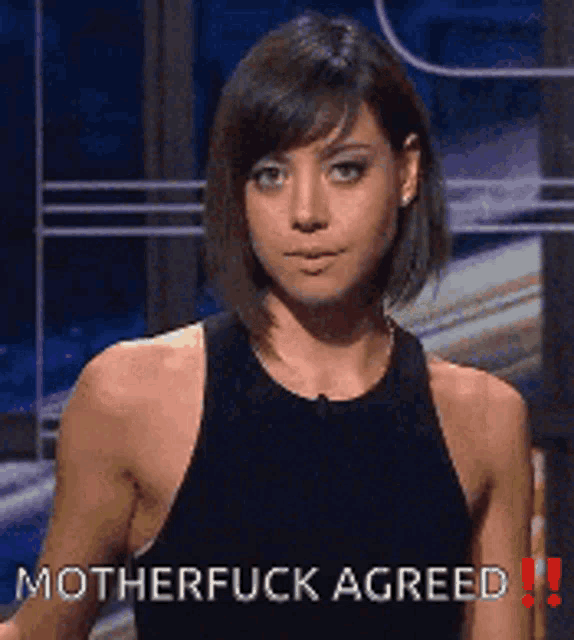 a woman in a black tank top says motherfuck agreed !