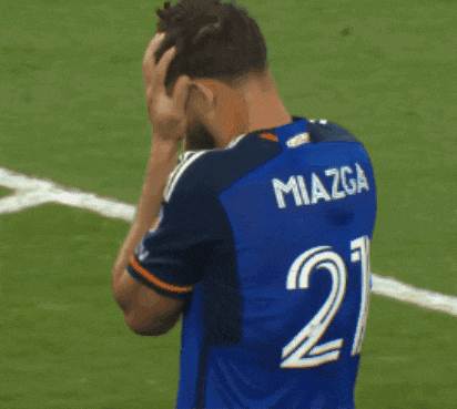 a man in a blue jersey with the number 1 on the front