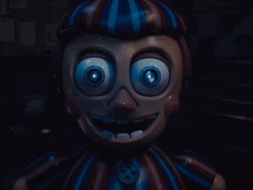 a balloon baby from five nights at freddy 's is glowing in the dark with glowing eyes .