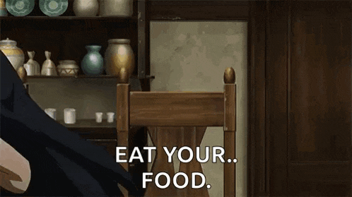 a girl is sitting in a chair with the words `` eat your food '' written on it .