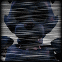 a blurry picture of a teddy bear with a striped background
