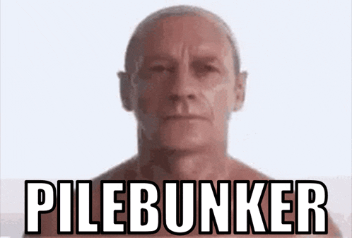 a man without a shirt is standing in front of a pilebunker sign .