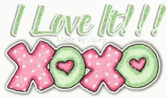 a pink and green sign that says `` i love it ! '' with hearts on it .