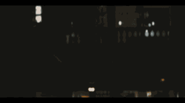 a blurred image of a metal pole with a yellow line in the foreground