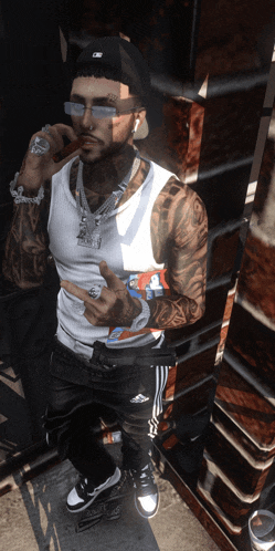 a man with a tattoo on his arm is wearing a white tank top and a black hat with the letter c on it