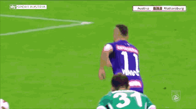 a soccer game between austria and mattersburg is being played