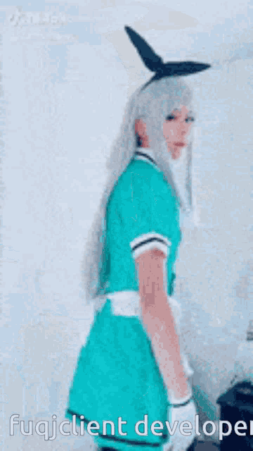 a woman in a maid costume is dancing in a video .