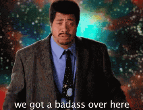 a man in a suit and tie with the words we got a badass over here