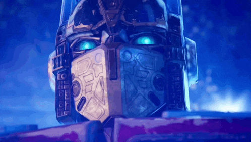 a close up of the face of a robot with blue eyes