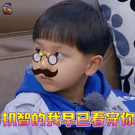 a young boy wearing glasses and a mustache is sitting on a couch