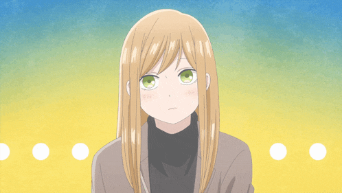 a girl with blonde hair and green eyes is looking at the camera