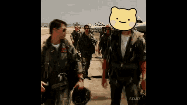 a group of soldiers are walking on a runway with a yellow teddy bear in the foreground