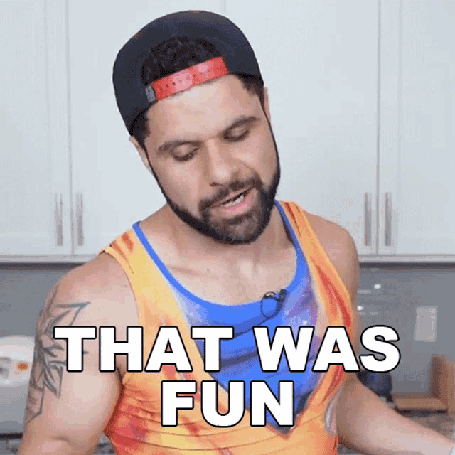 a man with a beard wearing a hat and a tank top says that was fun