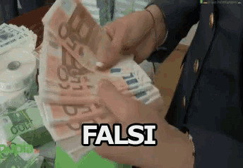 a person is holding a stack of money with the word falsi written on it