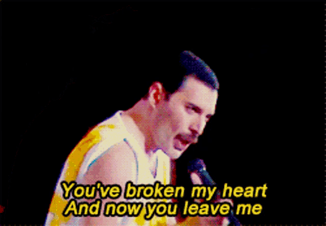 a man singing into a microphone with the words you 've broken my heart and now you leave me below him