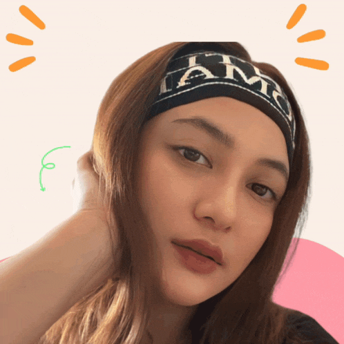 a woman wearing a headband that says iam