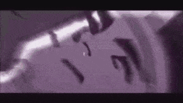 a purple background with a few pieces of paper falling from the sky .