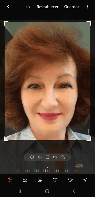a screenshot of a woman 's face with the word auto at the bottom right